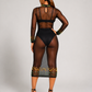 Back view of a luxury black sheer mesh dress featuring hand-beaded green and gold detailing, keyhole neckline, and fitted midi silhouette.