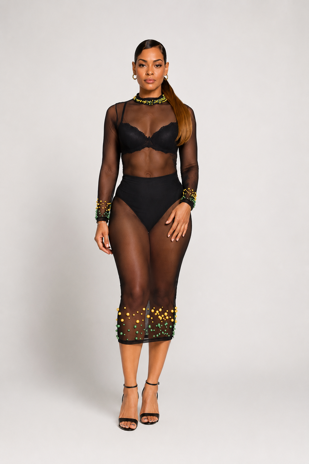 Luxury black sheer mesh midi dress with green and gold beaded embellishments, long sleeves, mock neckline, and fitted silhouette by Marlene Simone.