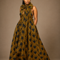 Luxury printed convertible multi wrap infinity maxi dress by Marlene Simone with gathered waist, flowing A-line skirt, and hidden pockets.