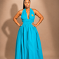 Luxury convertible infinity maxi dress by Marlene Simone with halter neckline, gathered waist, flowing A-line skirt, and hidden pockets.