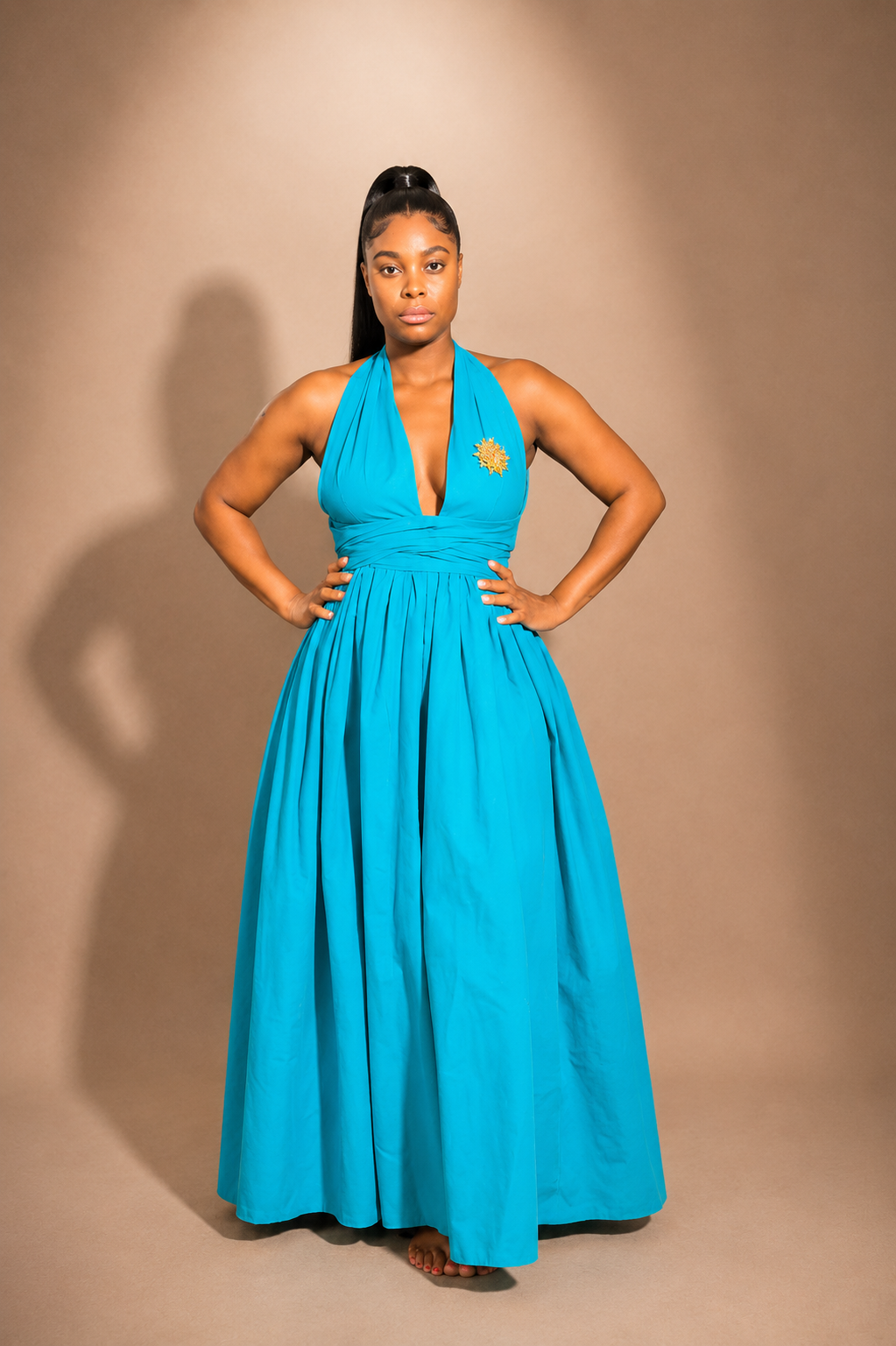 Luxury convertible infinity maxi dress by Marlene Simone with halter neckline, gathered waist, flowing A-line skirt, and hidden pockets.