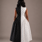 Elegant color block fit and flare midi dress for women featuring a high neckline, fitted bodice, gathered skirt, and modest silhouette with pockets 
by Marlene Simone.